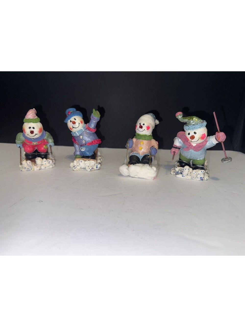 Set of 4 Christmas Snowmen Figures Skiing & Sledding Fun Resin Unmarked 3"/4"
